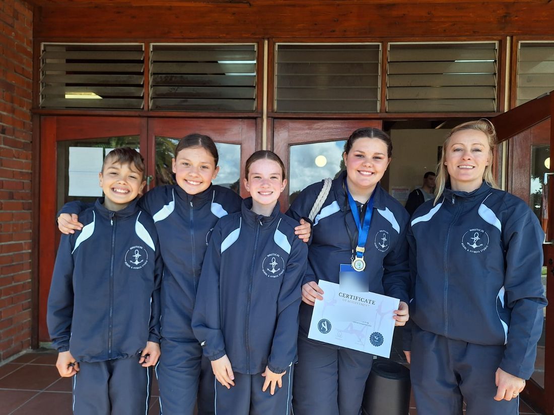 Nautical Aerial students in club tracksuits with a national competition certificate